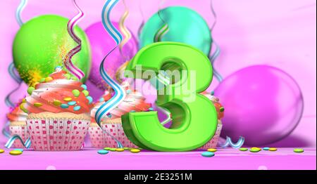 Birthday cupcake with sparking candle with the number 3 large in green with cupcakes with red cream decorated with chocolate chips and balloons on the Stock Photo