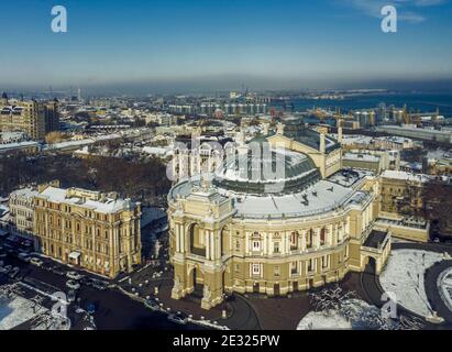 Air panorama of national opera and ballet theatre and sea port in Odessa Ukraine. Drone footage, winter time and sunny day. Stock Photo