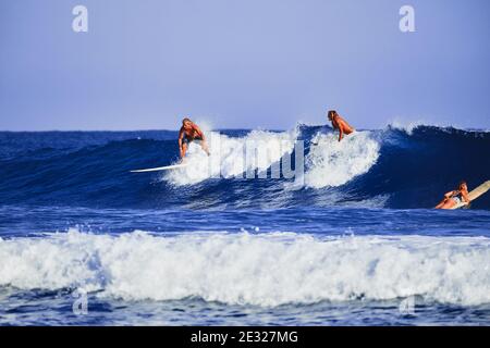 A man learns to stand on a surfboard. Surf school. Water sports, Atlantic ocean Dominican Republic. 29.12.2016. Stock Photo