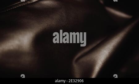 Texture of wrinkled natural brown leather, textile, leather background. Stock Photo
