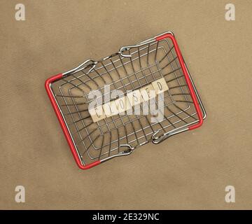 Closed written with wooden cubes in iron shopping cart, basket for epidemic coronavirus, business,stores and epidemic concept background top view Stock Photo