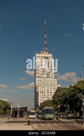 Busses on Avenida 9 de Julio, Buenos Aires, Argentina go past an image of Eva Peron on the CGT Union syndicate building Stock Photo