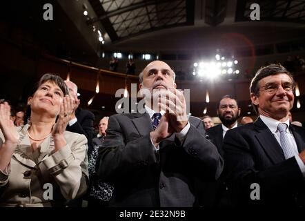 '(L-R) FDIC Chair Sheila Bair, Federal Reserve Bank Chairman Ben Bernanke and California Public EmployeesÀ Retirement System Chief Investment Officer Joseph Dear applaud as U.S. President Barack Obama signs the the financial reform bill into law during a ceremony at the Ronald Reagan Building and International Trade Center July 21, 2010 in Washington, DC. A sweeping expansion of federal financial regulation in the wake of the worst recession since the Great Depression, the bill will create a consumer protection agency, lay out a blueprint for disassembling financial entities considered ''too b Stock Photo