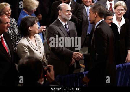 'U.S. President Barack Obama shakes hands with Federal Reserve Bank Chairman Ben Bernanke (C) as FDIC Chair Sheila Bair (2nd L) looks on after Obama signed the the financial reform bill into law during a ceremony at the Ronald Reagan Building and International Trade Center July 21, 2010 in Washington, DC. A sweeping expansion of federal financial regulation in the wake of the worst recession since the Great Depression, the bill will create a consumer protection agency, lay out a blueprint for disassembling financial entities considered ''too big to fail,'' and many other reforms. Photo by Win Stock Photo