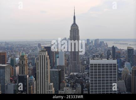 The Empire State Building and South Manhattan are seen at sunset from the roof of Rockefeller Center in New York City, NY, USA in August 2010. A soaring new office tower in New York would disturb views of the Empire State Building and diminish the signature symbol of the city's skyline, the famous skyscraper's managers said on Monday at city council hearings. Vornado Realty Trust's proposed 67-story building, known as 15 Penn Plaza, would be built two blocks away and stand nearly as tall as the landmark that has stood largely unobstructed in midtown Manhattan since it was built in 1931. Penn P Stock Photo