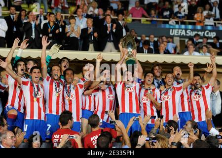 Athletico Madrid's players celebrate with the cup after winning the match against Inter Milan after the UEFA Supercup soccer match, Inter Milan vs Athletico Madrid at Louis II of Monaco Stadium in Principaute of Monaco on August 27, 2010. Athletico Madrid won 2-0. Photo by Henri Szwarc/ABACAPRESS.COM Stock Photo