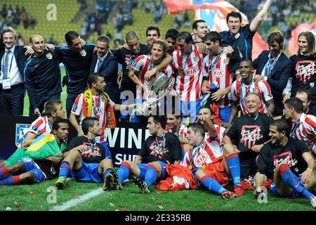 Athletico Madrid's players celebrate with the cup after winning the match against Inter Milan after the UEFA Supercup soccer match, Inter Milan vs Athletico Madrid at Louis II of Monaco Stadium in Principaute of Monaco on August 27, 2010. Athletico Madrid won 2-0. Photo by Henri Szwarc/ABACAPRESS.COM Stock Photo