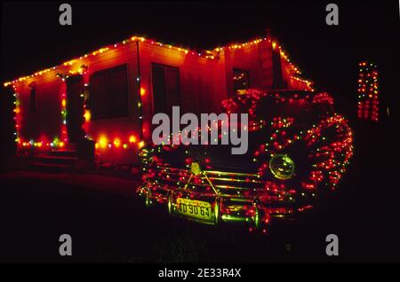 1950 Hudson Commodore decorated for Christmas (classic license plate is three years older than the automobile). Stock Photo