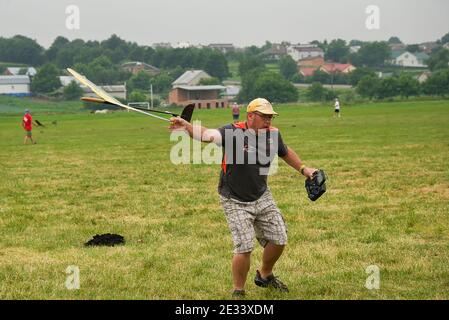 Lviv, Ukraine - July 23, 2017: Unknown aircraft modeler  launches his own radio-controlled  model  glider  in the countryside near the city of Lviv., Stock Photo