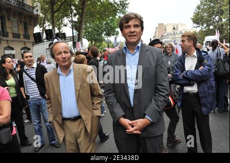 French Former sociaslits meiniter Roger-Gerard Schwartzenberg and French Socialist Party member Arnaud Montebourg participate to a demonstration in Paris, France on September 23, 2010 as a second round of strikes against President Nicolas Sarkozy's plan to raise the retirement age to 62. Photo by Mousse/ABACAPRESS.COM Stock Photo