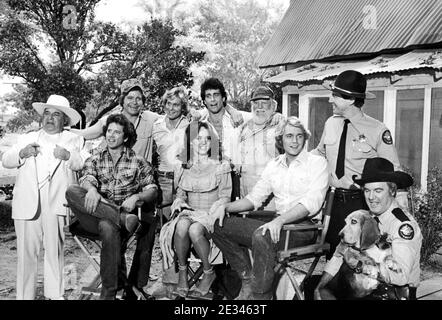 'The Dukes Of Hazzard' Cast Standing L To R:  Sorrell Booke, Ben Jones, Byron Cherry, Christopher Mayer, Denver Pyle, Sonny Shroyer Sitting L To R: Tom Wopat, Catherine Bach, John Schneider, James Best And Flash The Dog   Credit: Ralph Dominguez/MediaPunch Stock Photo