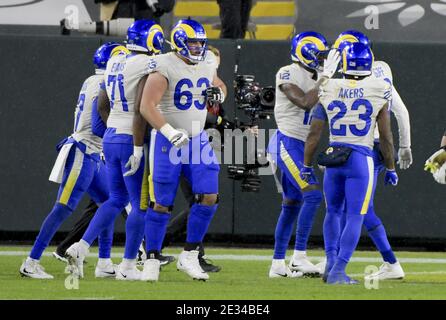 Green Bay, United States. 16th Jan, 2021. Green Bay Packers fan wearing a  Cheese Head cheers on his team as they defeat the Los Angeles Rams 32-18  during the Divisional Playoff at