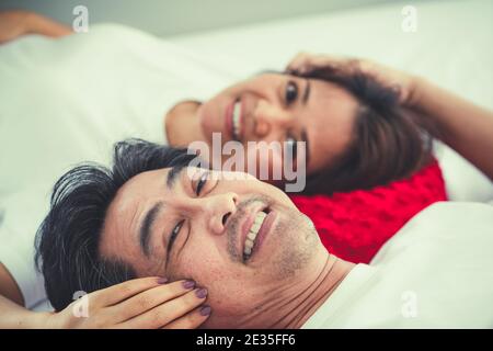 Happy Asian senior couple having good time at home. Old people retirement and healthy citizens elderly concept. Stock Photo