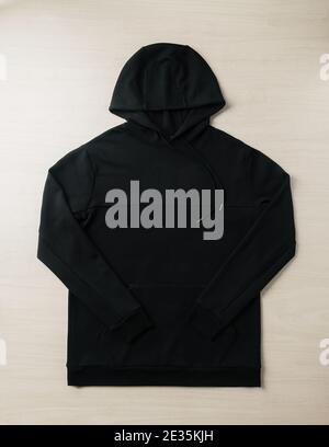 Blank black hoodie sweatshirt long sleeve mockup plank on the floor. Template for place your design. Stock Photo