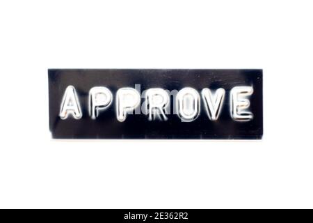Embossed letter in word approve on black banner with white background Stock Photo