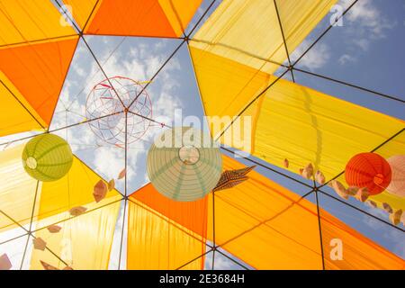 Hanging paper sphere lights for a party with a blue sky background. Stock Photo