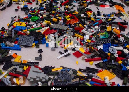 children's construction kit is scattered on the floor Stock Photo