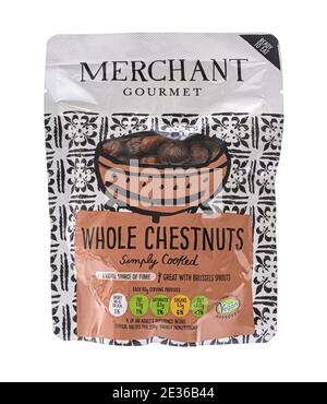 SWINDON, UK - JANUARY 16, 2021:  Packet of  Merchant ready to eat gourmet whole chestnuts - Simply cooked and approved by the vegan society on a white Stock Photo