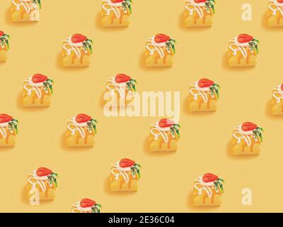 Minimal  concept.Trendy Candy pattern made with various  candy bright light yellow background Stock Photo
