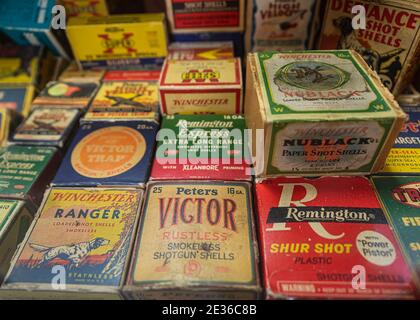 Placerville, USA - November 25, 2020: Vintage shotgun shells cartridge boxes by Remington, Winchester and other ammunition manufacturers at a gun shop Stock Photo