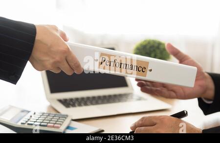 staff sending performance management file to the executives. select focus. Stock Photo