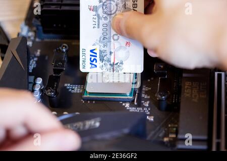 Moscow, Russia -25 Dec 2020: Applying thermal paste to the CPU of a desktop PC Stock Photo