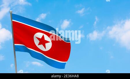 North Korea flag on pole. Blue sky. National flag of North Korea Stock Photo