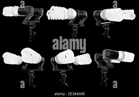 Lightbulbs in lamp holder on studio stand isolated on black background Stock Photo