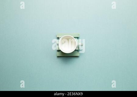 Empty mug cup on mint green background. top view, copy space Stock Photo