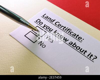 One person is answering question about land certificate. Stock Photo