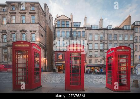 Edinburgh, Scotland - July 27 2017: Traditional old-fashioned red telephone boxes along the Royal Mile in Edinburgh's touristic Old Town on a summer e Stock Photo