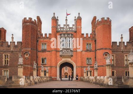 London, UK - July 18 2017: The royal courtyard entrance to the 16th century Hampton Court Palace, residence of Henry VIII at Richmond Upon Thames, in Stock Photo
