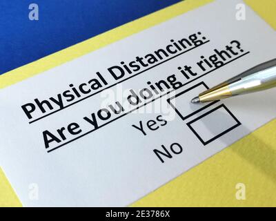 One person is answering question about physical distancing. Stock Photo