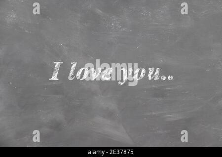 Inscription I love you on the chalk school blackboard children's drawing. Valentine's day card, love Stock Photo