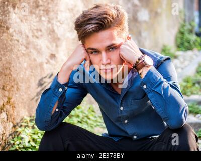 One handsome young man in city setting Stock Photo