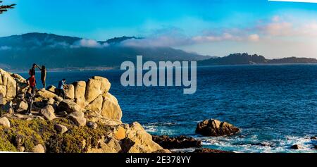 Pebble Beach, California, February 17, 2018:  Rock formations add to to the seashore vistas near Pebble Beach. Stock Photo