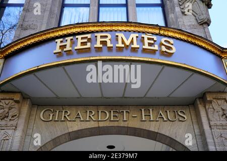 Hermès store logo at Giradet-Haus on Königsallee in downtown Düsseldorf. Hermès is a French luxury brand founded in 1837. Stock Photo