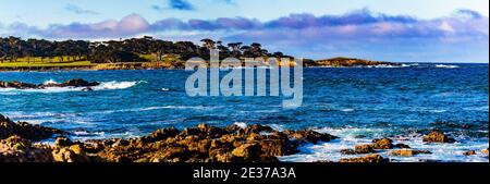 Pebble Beach, California, February 17, 2018:  Panorama view of Fan shell Beach with the Cypress Point Golf Course in the background. Stock Photo