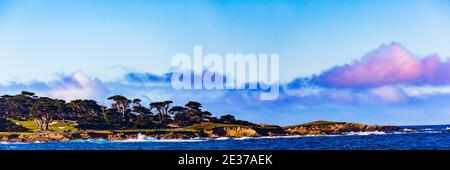 Pebble Beach, California, February 17, 2018:  Panorama view of Fan shell Beach with the Cypress Point Golf Course in the background. Stock Photo