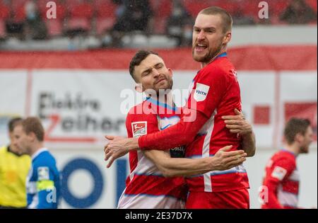 Heidenheim, Germany. 17th Jan, 2021. Football: 2nd Bundesliga, 1. FC Heidenheim - Darmstadt 98, Matchday 16 at Voith Arena. Heidenheim's Denis Thomalla (l) and Patrick Mainka celebrate. Credit: Stefan Puchner/dpa - IMPORTANT NOTE: In accordance with the regulations of the DFL Deutsche Fußball Liga and/or the DFB Deutscher Fußball-Bund, it is prohibited to use or have used photographs taken in the stadium and/or of the match in the form of sequence pictures and/or video-like photo series./dpa/Alamy Live News
