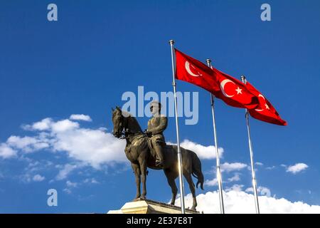 The statue of Ataturk and national flags of modern Turkey in Ulus - Ankara, Turkey Stock Photo