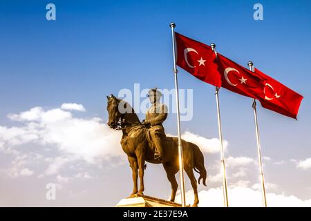 The statue of Ataturk and national flags of modern Turkey in Ulus - Ankara, Turkey Stock Photo