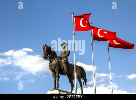 The statue of Ataturk and national flags of modern Turkey in Ulus - Ankara, Turkey Stock Photo