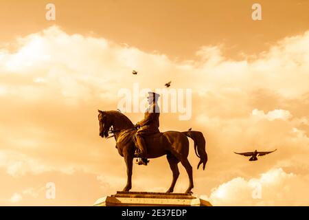 The statue of Ataturk and national flags of modern Turkey in Ulus - Ankara, Turkey Stock Photo