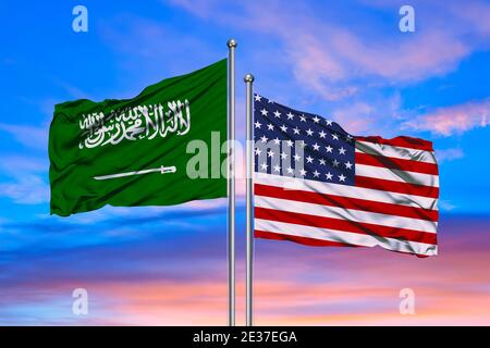 3D illustration of United States of America & Saudi Arabia Flags are waving in the sky with dark clouds Stock Photo