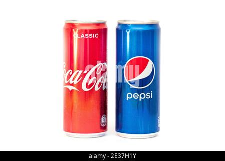 MOSCOW - JAN 15: Two cans with soft drinks Coca-Cola and Pepsi-Cola in new design isolated on white in Moscow, January 15. 2021 in Russia Stock Photo