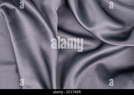 wavy rippled gray blue purple silk satin fabric background Stock Photo