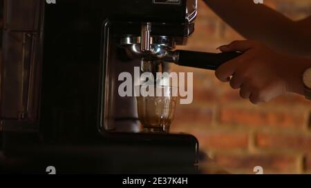 espresso shot from coffee machine make by barista in coffee shop cafe Stock Photo