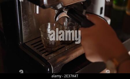 espresso shot from coffee machine make by barista in coffee shop cafe Stock Photo