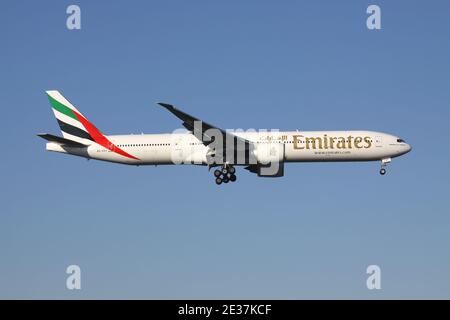 Emirates Boeing 777-300 with registration A6-EGY on short final for runway 05R of Dusseldorf Airport. Stock Photo